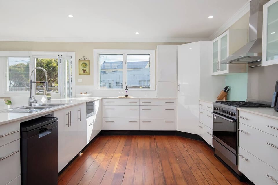 Prepare meals in the full-size kitchen, complete with a gas cooktop, oven, dishwasher, microwave, toaster, fridge, and a pour-over coffee setup for slow mornings.