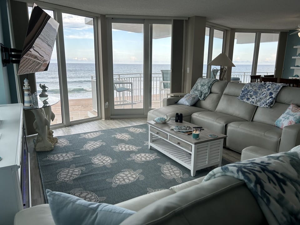 Living Room with amazing views of beach and ocean! 