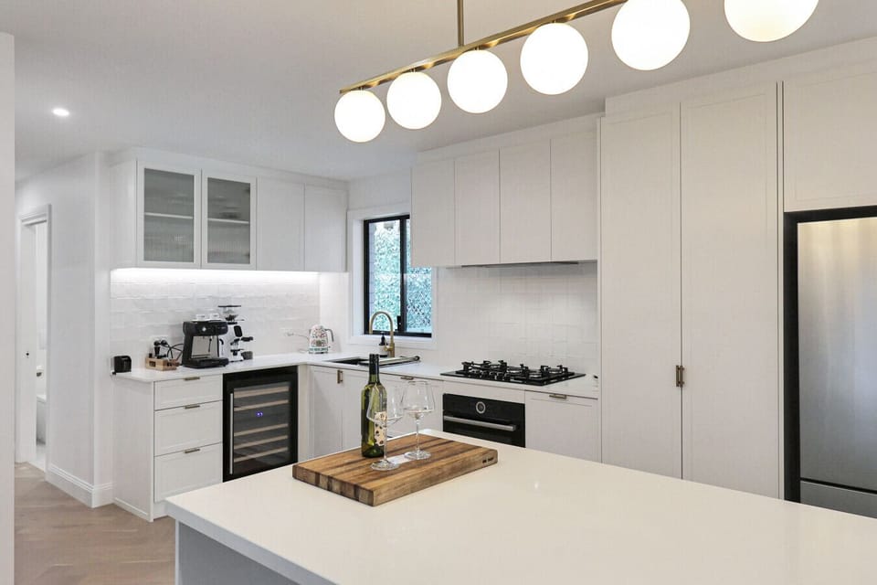 Fully equipped kitchen with clean design and modern amenities.