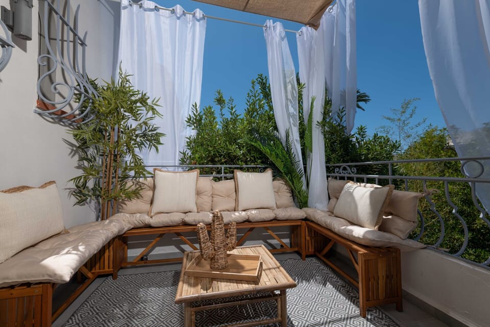Relaxation area of your apartment with its furnished open-air terrace – ideal for unwinding at Mandara Beach.