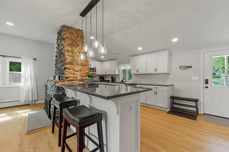 Ample cabinets stocked with cookware and essentials.