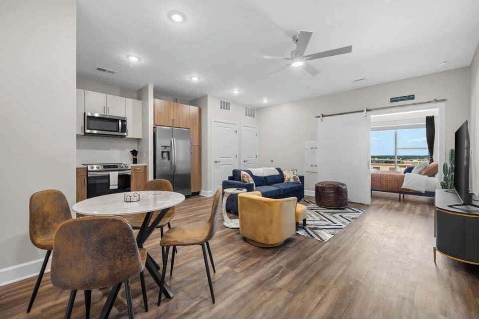 - Open-concept living space with dining area perfect for extended stays  
- Modern kitchen bright seating and warm finishes  
- Spacious layout offering comfort for travelers and groups  
