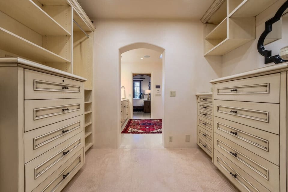 Primary Closet that leads to Bedroom 3 with bathroom and exit.