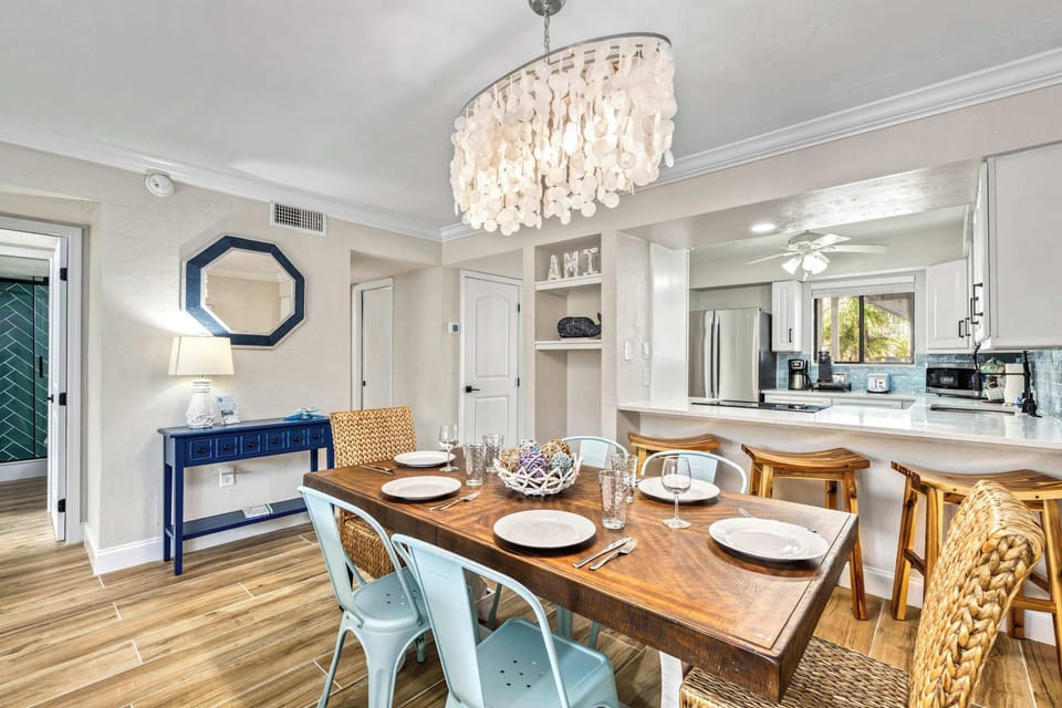 Open-Concept Living & Dining – Formal dining table with seating for six, additional breakfast bar stools for even more flexible seating