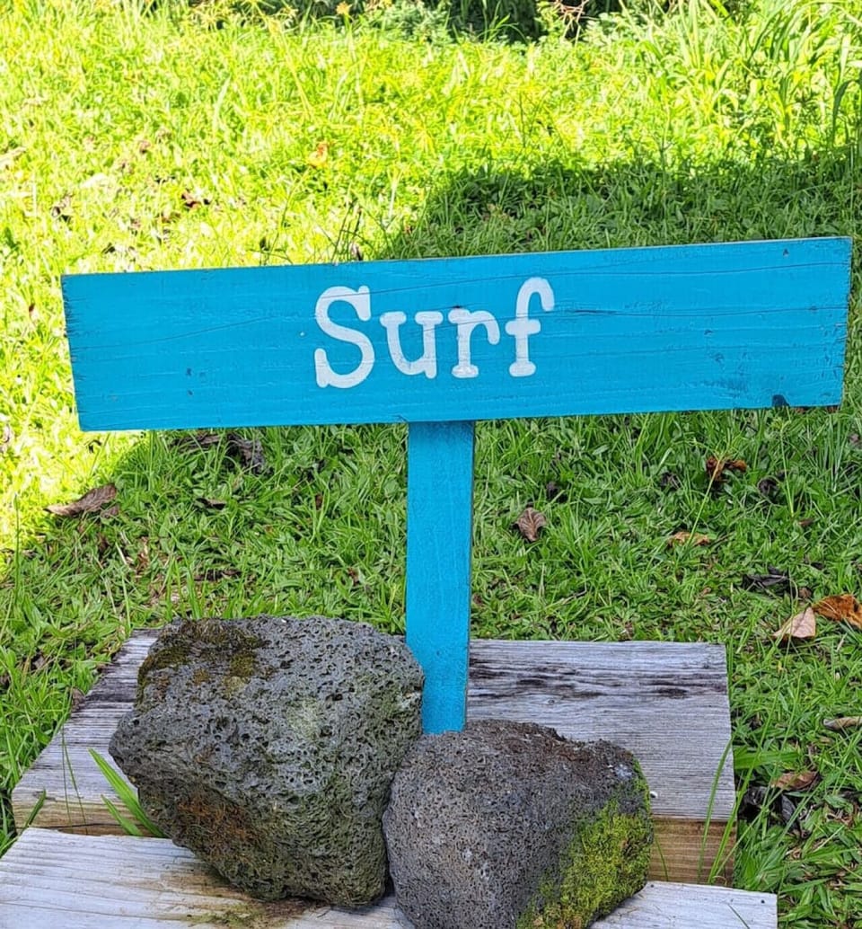 Vibrant `Surf` sign marking the entrance to a fun adventure.