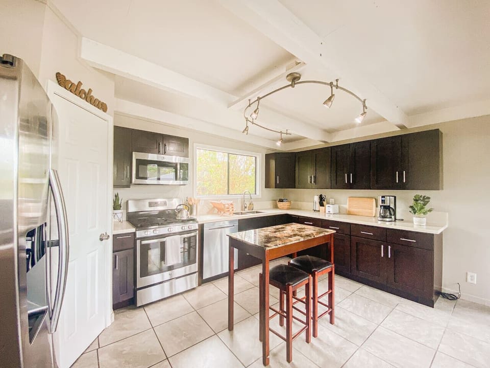 Fully equipped kitchen with modern appliances and a welcoming feel.