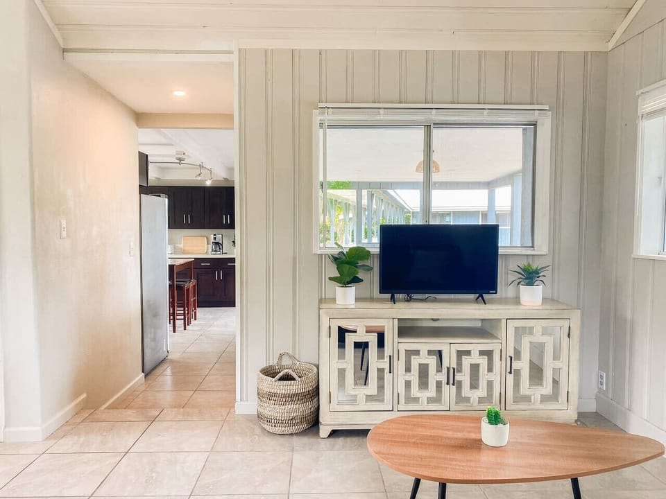 Modern living area with a TV and stylish furnishings.