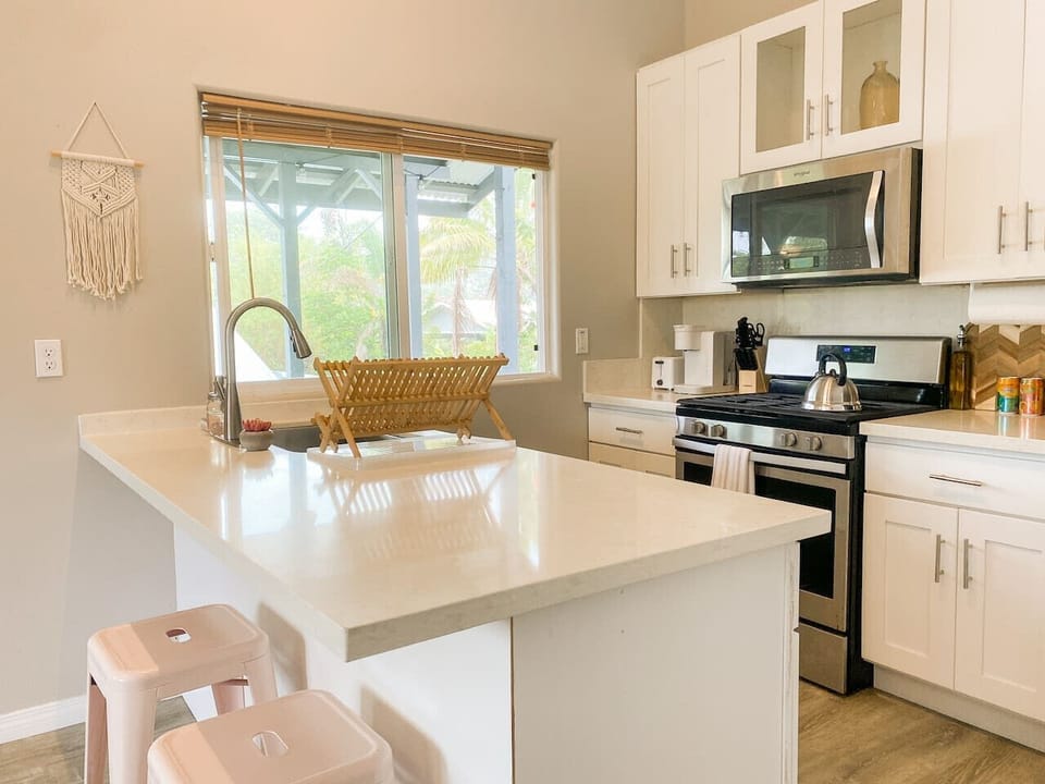 Your culinary adventures unfold in this sun-drenched kitchen.