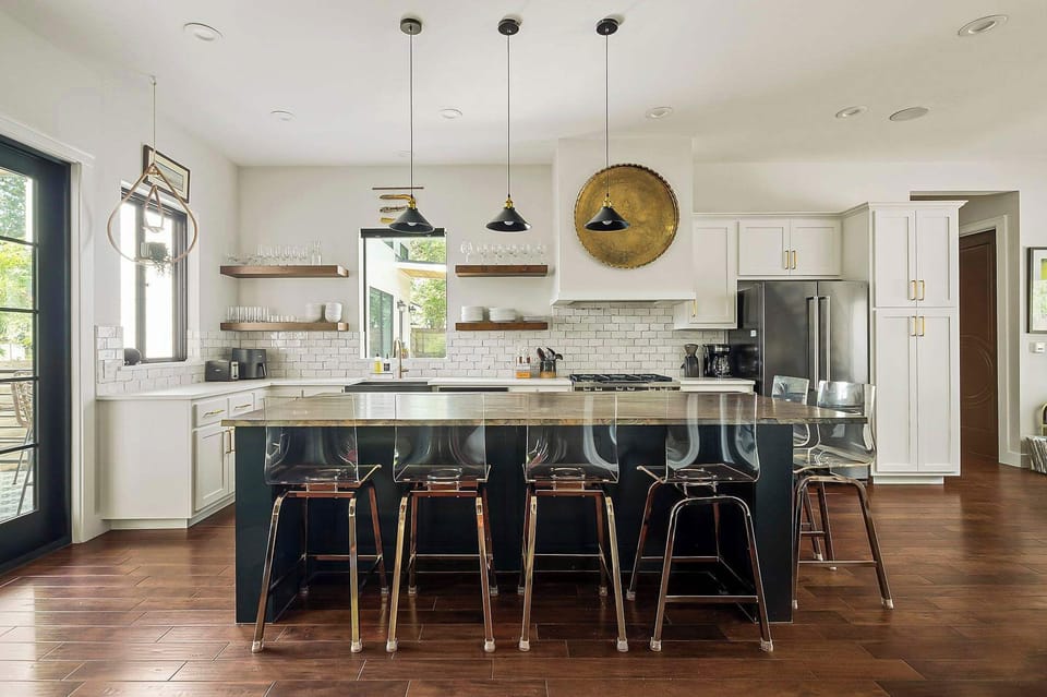 Cook, dine, and connect in the fully equipped kitchen, complete with bar seating — perfect for casual meals, morning coffee, or evening cocktails.