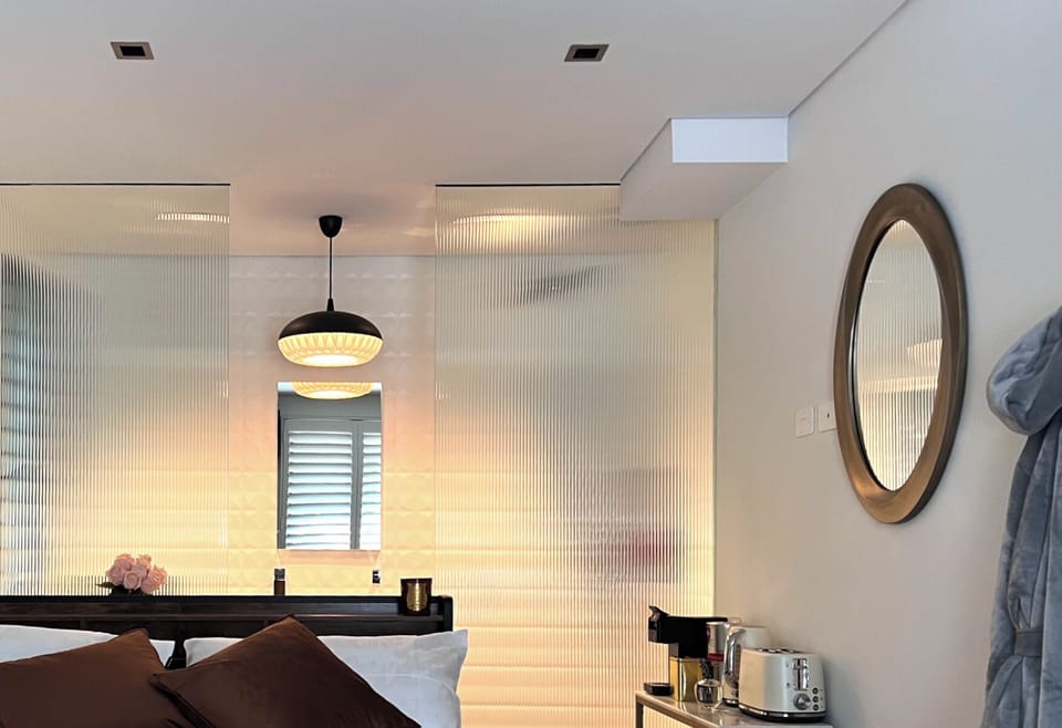 Designer touches throughout including robe, shampoo, conditioner.
