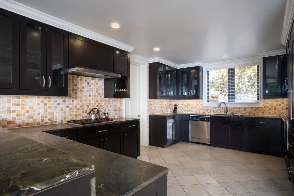 Gather around sleek counters for easy breakfasts and cocktails.