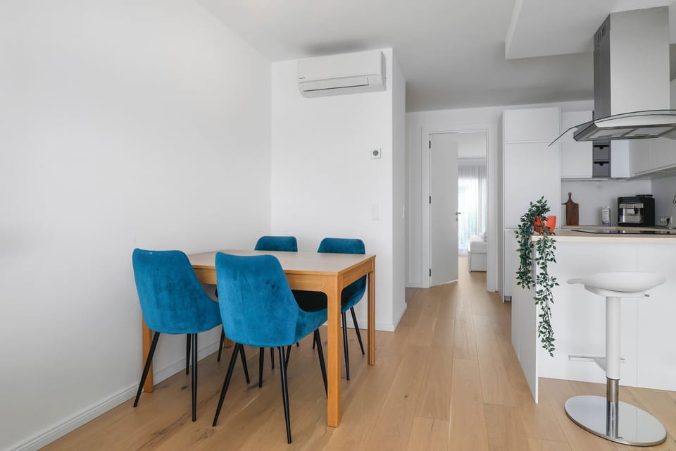 Cozy Dining Area with Velvet Chairs and a Minimalist Aesthetic