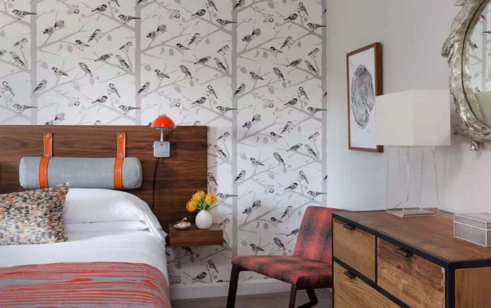 Settle in with warm wood tones and curated, calming decor.