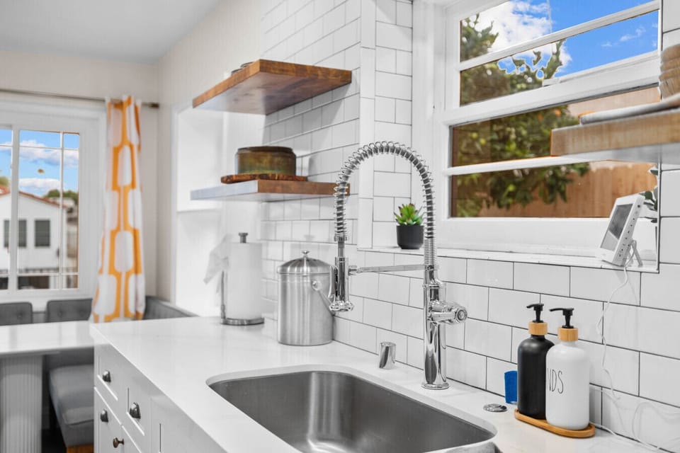 Rinse up with a garden view and everything you need within reach.