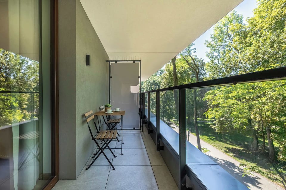 The balcony offers a peaceful retreat with comfortable seating.