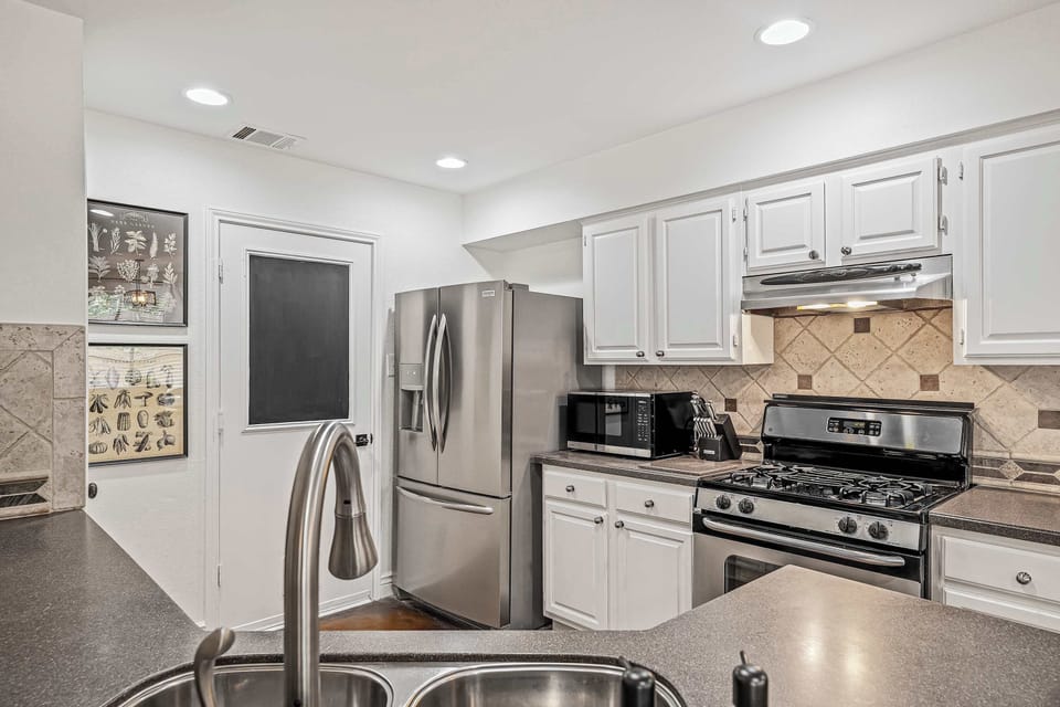 Full kitchen view from bar area