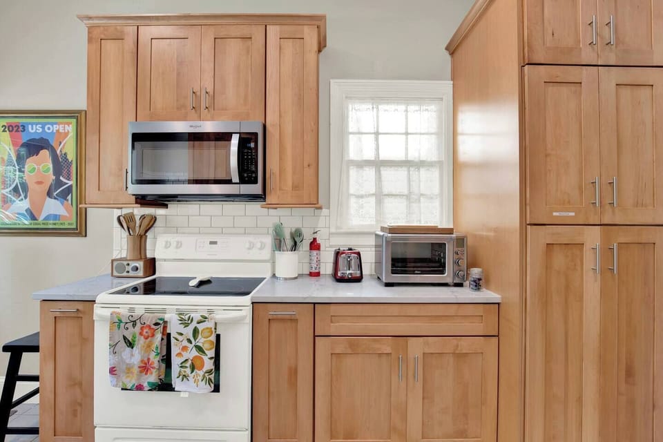 Dishes, glasses and extra appliances can be found in the cabinets.The kitchen is fully stocked with everything you need to cook and enjoy meals during your stay. (1)