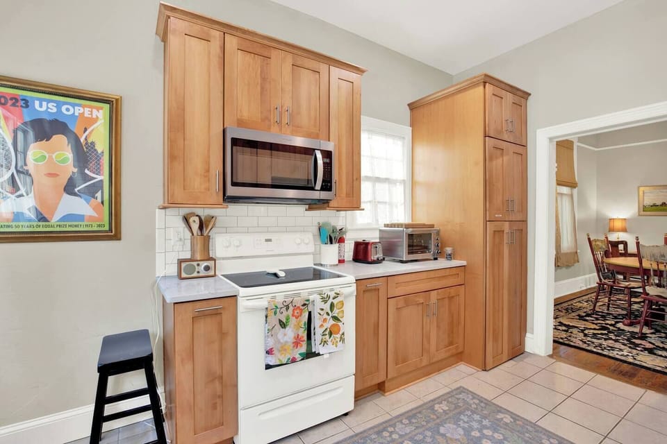 Dishes, glasses and extra appliances can be found in the cabinets.The kitchen is fully stocked with everything you need to cook and enjoy meals during your stay. (2)
