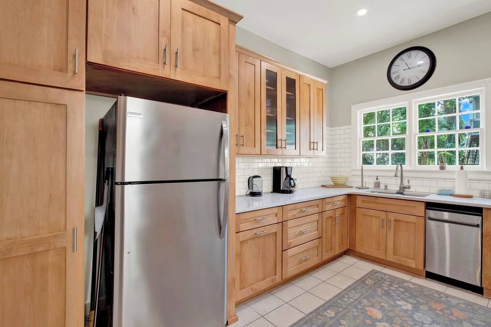 Dishes, glasses and extra appliances can be found in the cabinets.The kitchen is fully stocked with everything you need to cook and enjoy meals during your stay. (3)