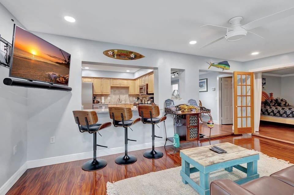 Sip, chat, and relax in our airy Florida sunroom with inviting bar seating.