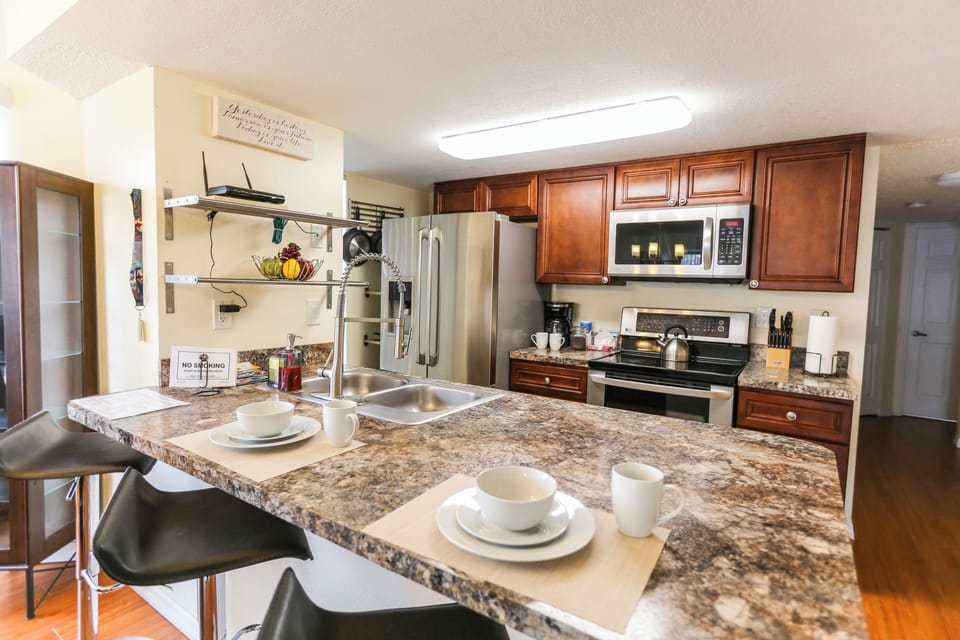 Includes a convenient breakfast bar with additional seating—perfect for casual dining or entertaining guests.