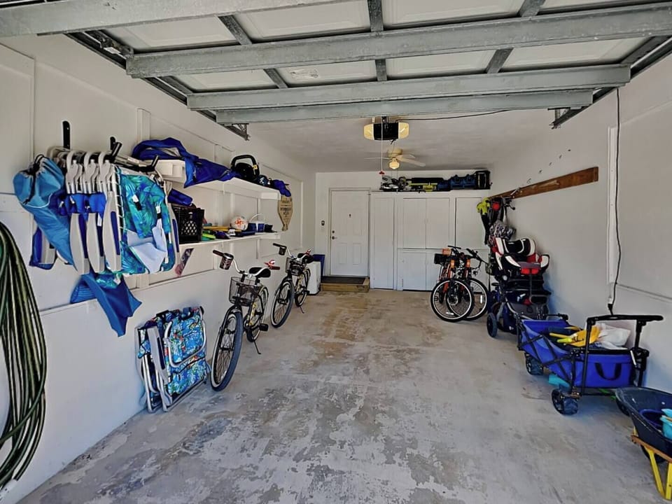 Garage area with beach toys, bikes, and more.