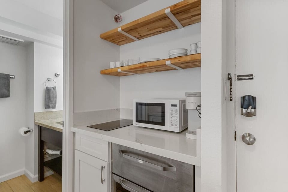 Make quick meals with a hot plate, microwave, and mini fridge.