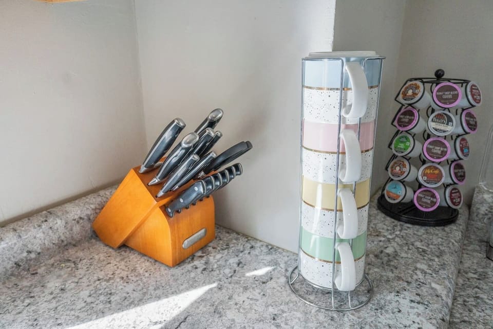 Cook like a pro with the provided utensils in this well-equipped kitchen.
