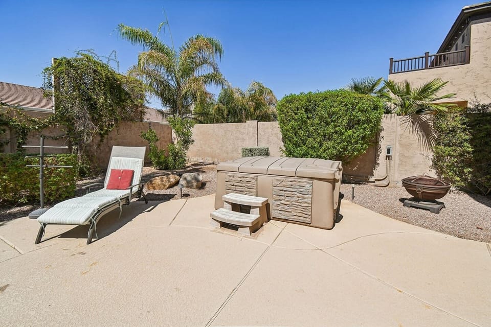 Private spa and fire pit seating area—unwind under the stars.


