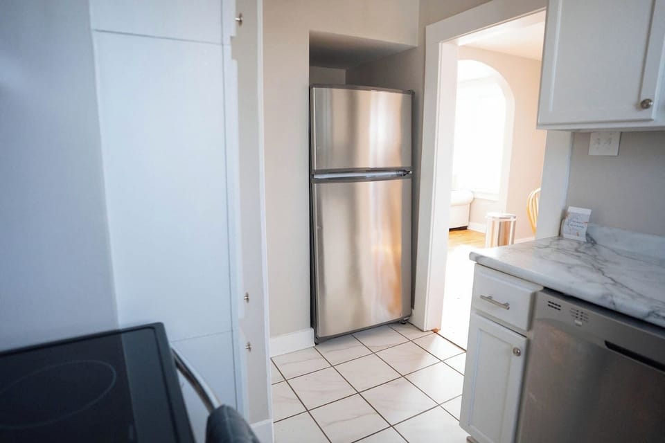 The kitchen is stocked with all the essentials—fridge, stove, oven, microwave, dishwasher, coffee maker, and blender. Whether you're making a full meal or just a quick cup of coffee, you’ll have everything you need.