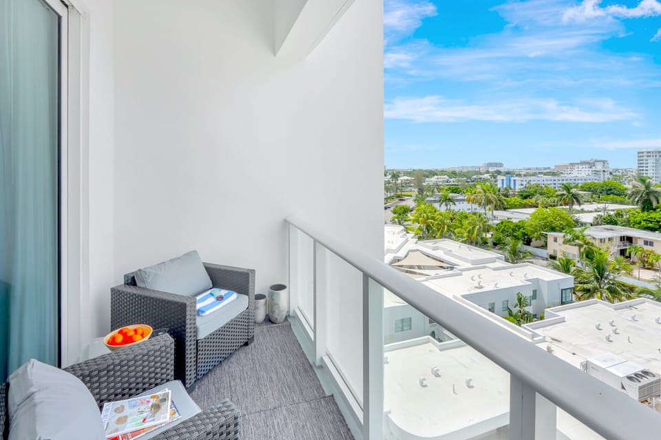 Balcony | Offers city views, with a comfortable seating area.