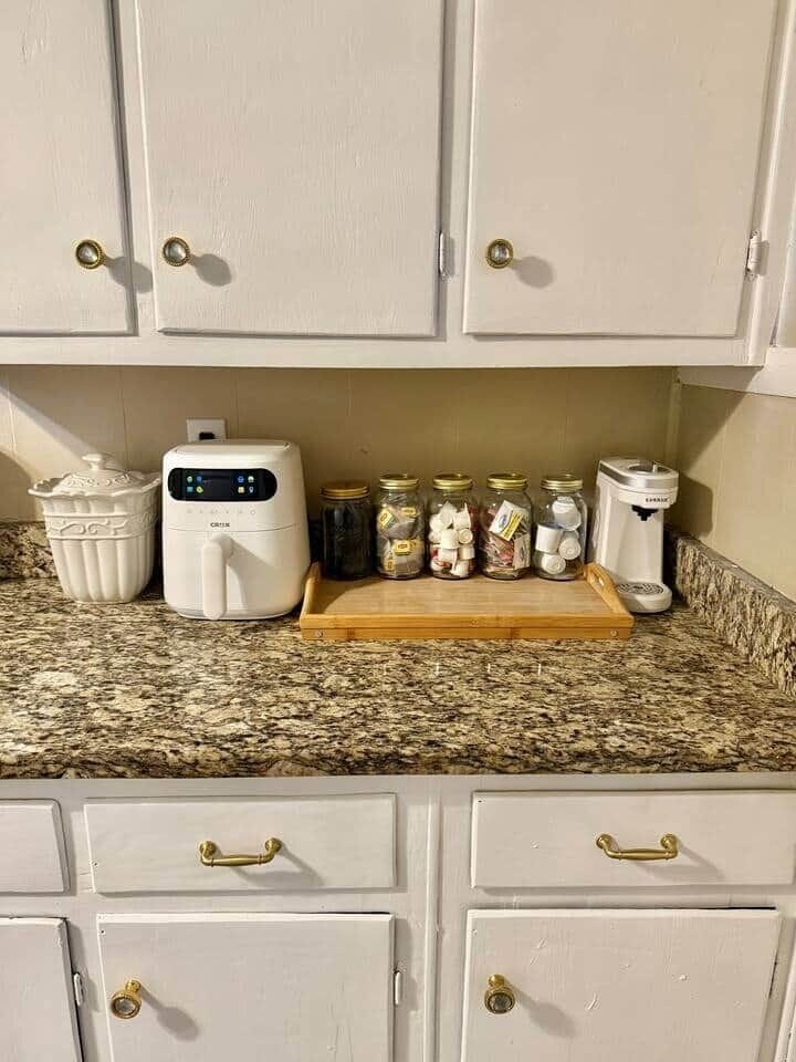 Air fryer & Coffee station fully stocked with k-cup pods, sugar packets, creamer pods, coffee stir straws, & tea bags for tea lovers!