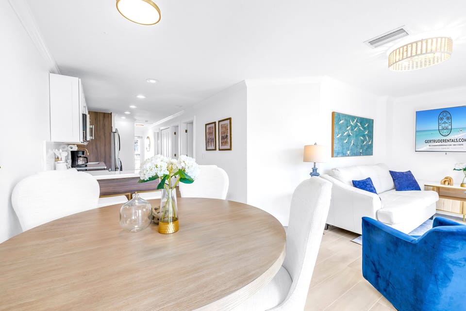 Dining area on edge of patio area just outside kitchen and living space.