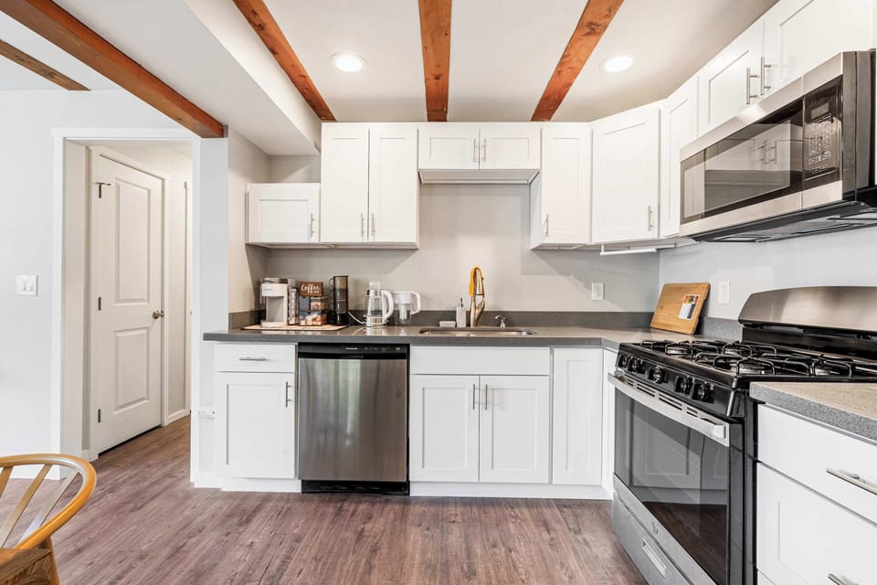 Chef's kitchen with charm​ showcasing stainless steel appliances.