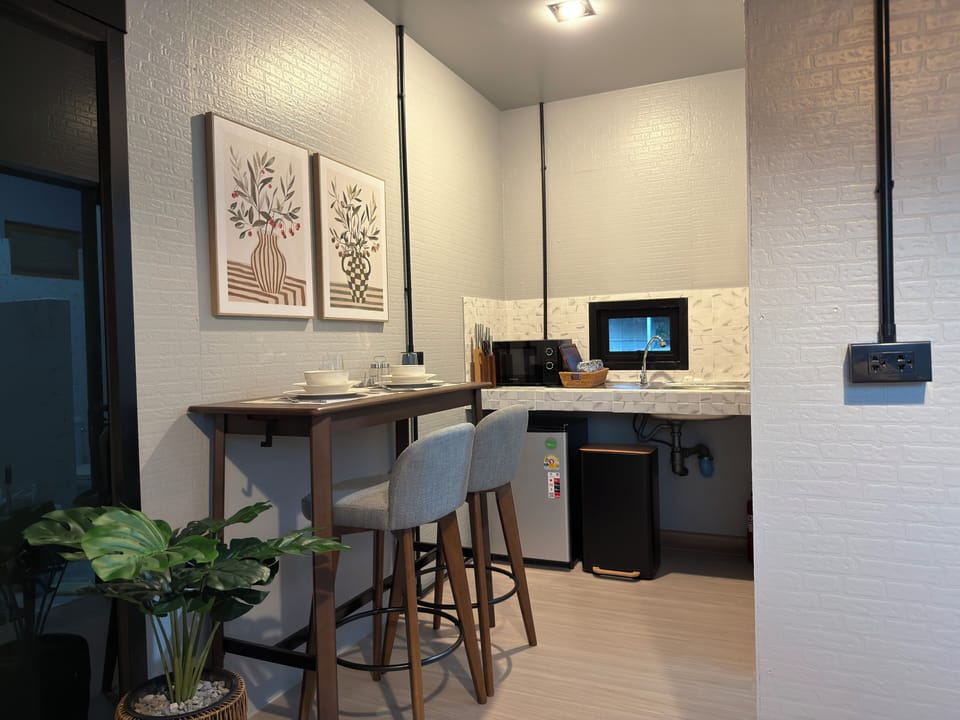 You enjoy a stylish breakfast nook, ready to start your day in comfort.