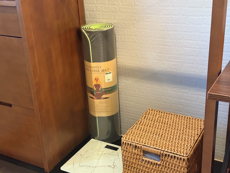 You roll out an eco-friendly yoga mat, ready for your next relaxing stretch.