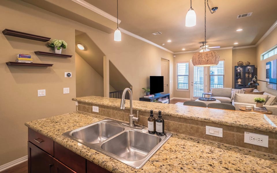 View of kitchen sink to dining table and lining room 