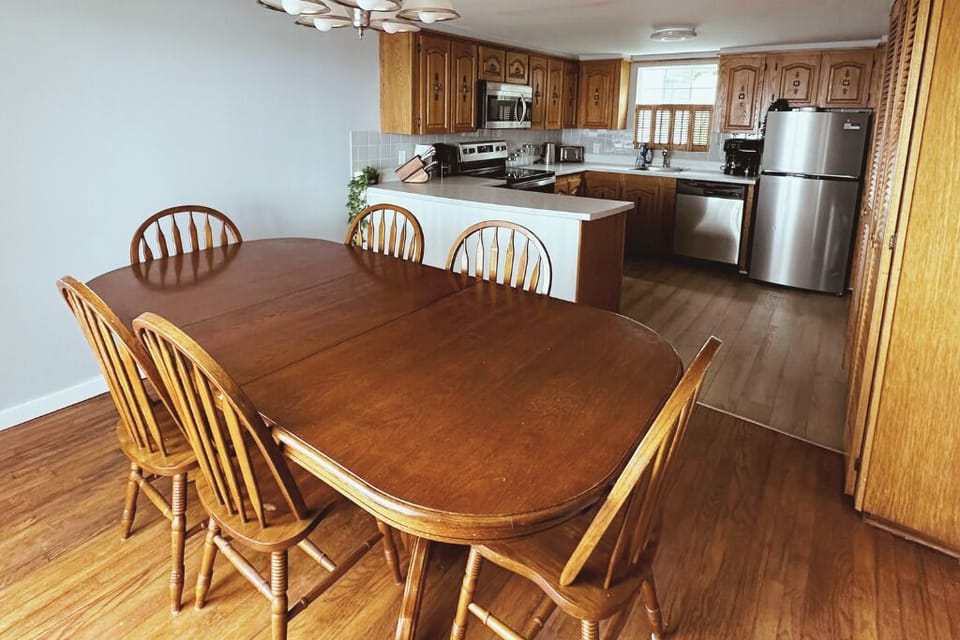 Inviting dining space beside a fully equipped kitchen — ideal for group meals