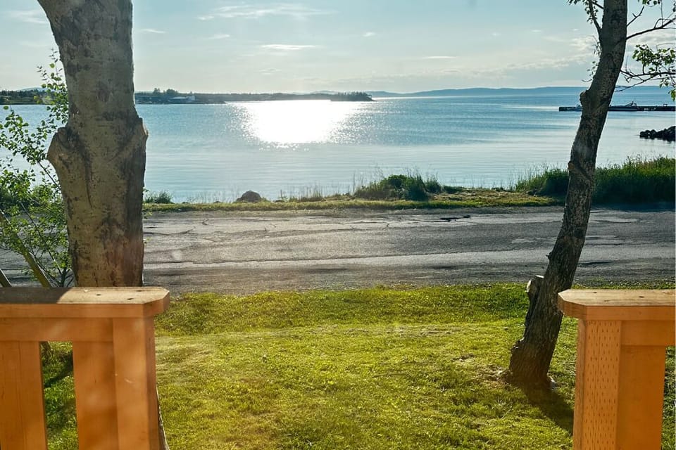 Open the door to awe — breathtaking bay views right from porch.