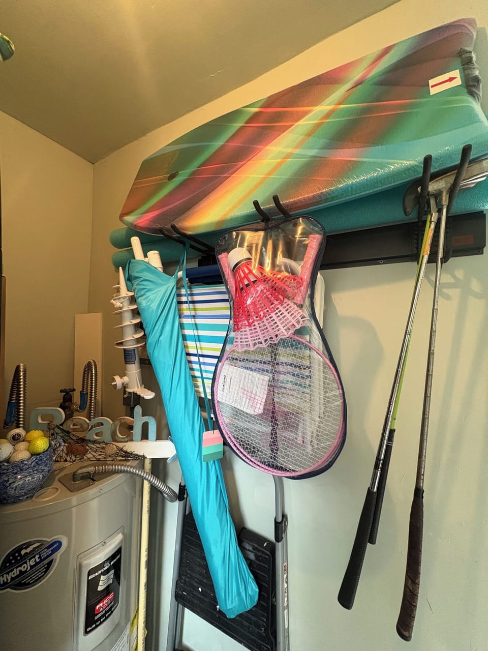 Beach chairs, umbrella, boogie board, etc. Golf balls, putters.