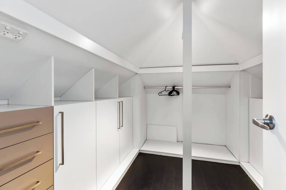 The second bedroom’s walk-in wardrobe provides generous hanging space and built-in drawers, making it easy to keep your room feeling organised and clutter-free.