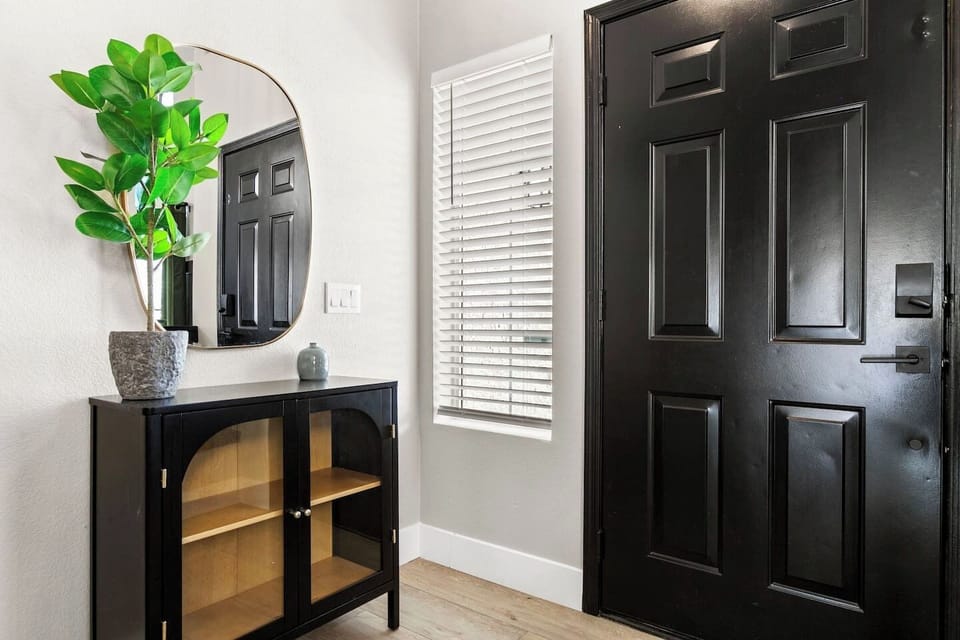 Convenient foyer with built-in storage for car keys and other essentials. 