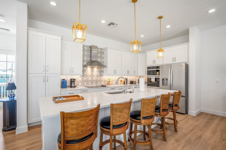 Pink Pearl Kitchen: Cook and dine comfortably in the full kitchen with island seating. Enjoy a thoughtful welcome basket with coffee, chocolates, dishwasher pods, and helpful guide! 