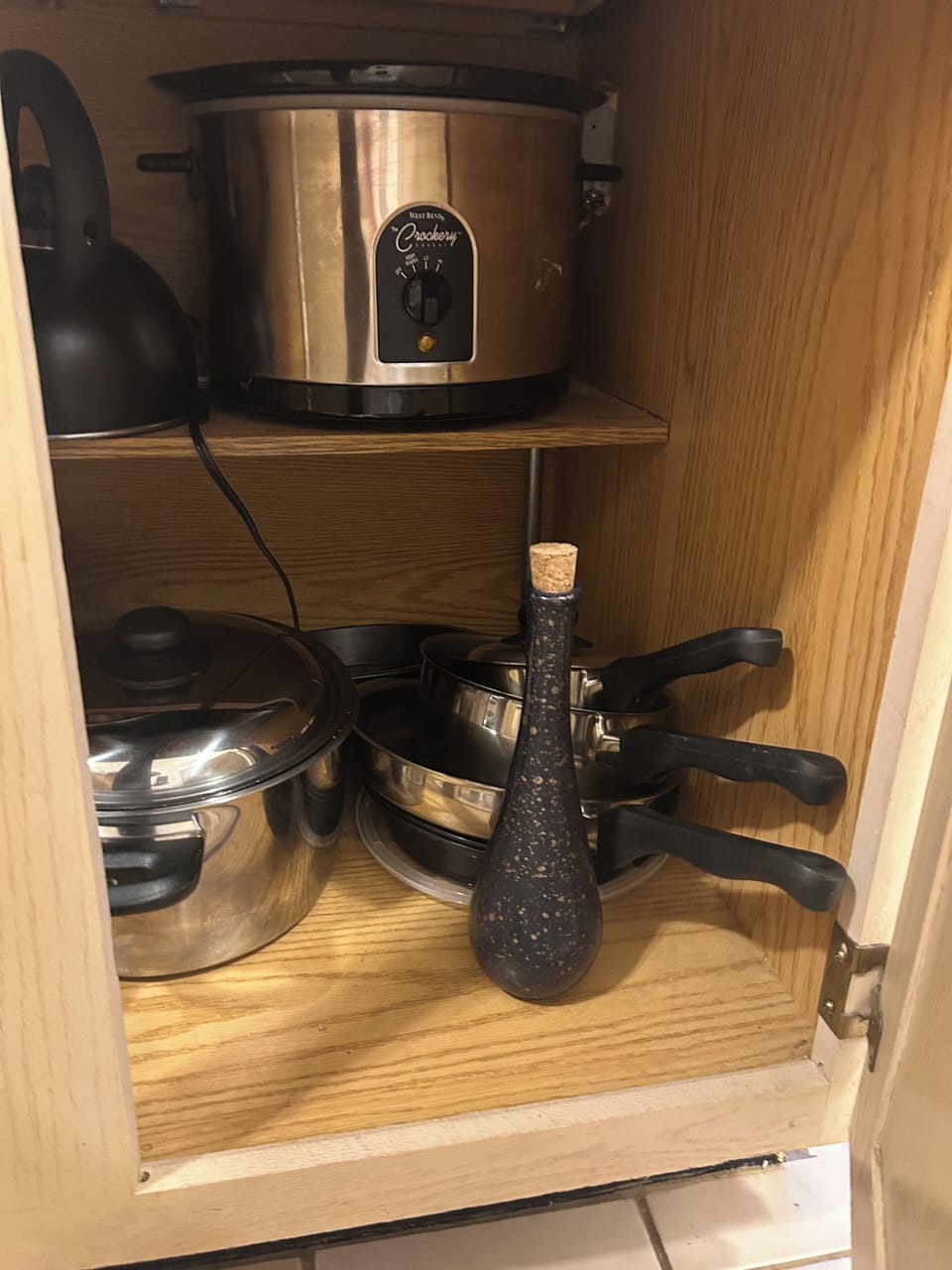 Fully stocked kitchen with pots, pans, crock pot