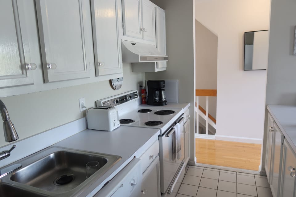 Fully loaded kitchen.  Hall to Living room