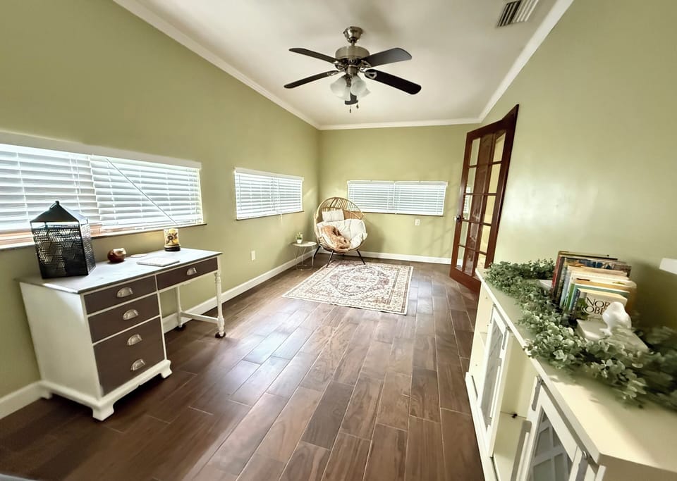 Reading nook with books and office area. Good place for a quiet retreat.