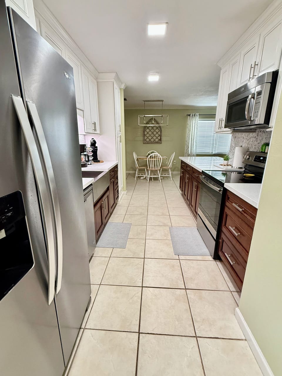 Refrigerator includes ice maker & water dispenser.