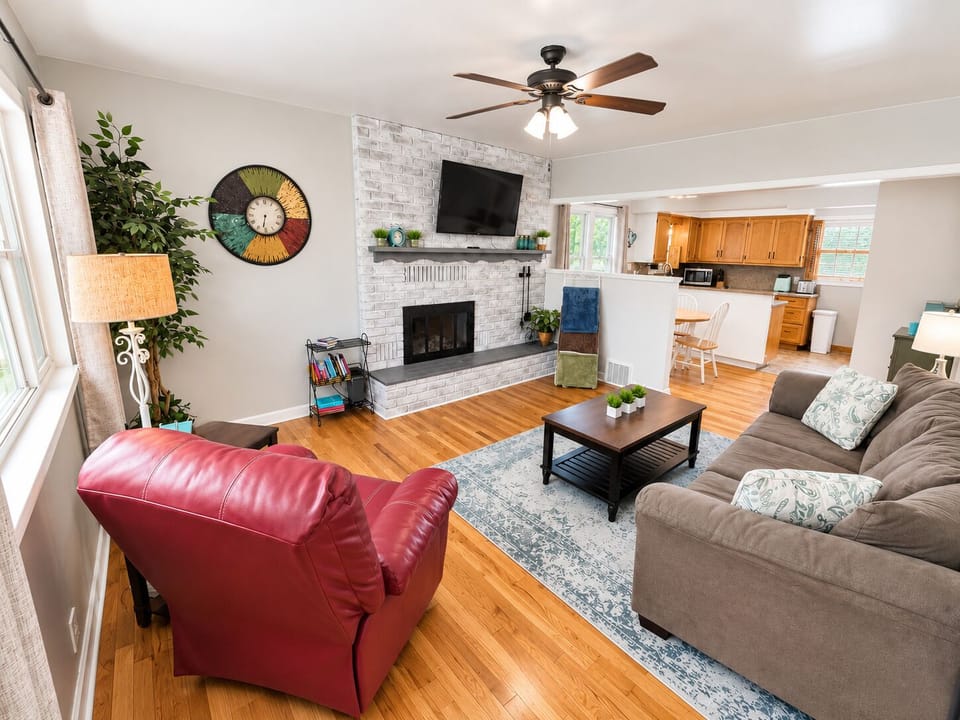 Comfortable living room with fireplace, Smart TV, and open floor plan