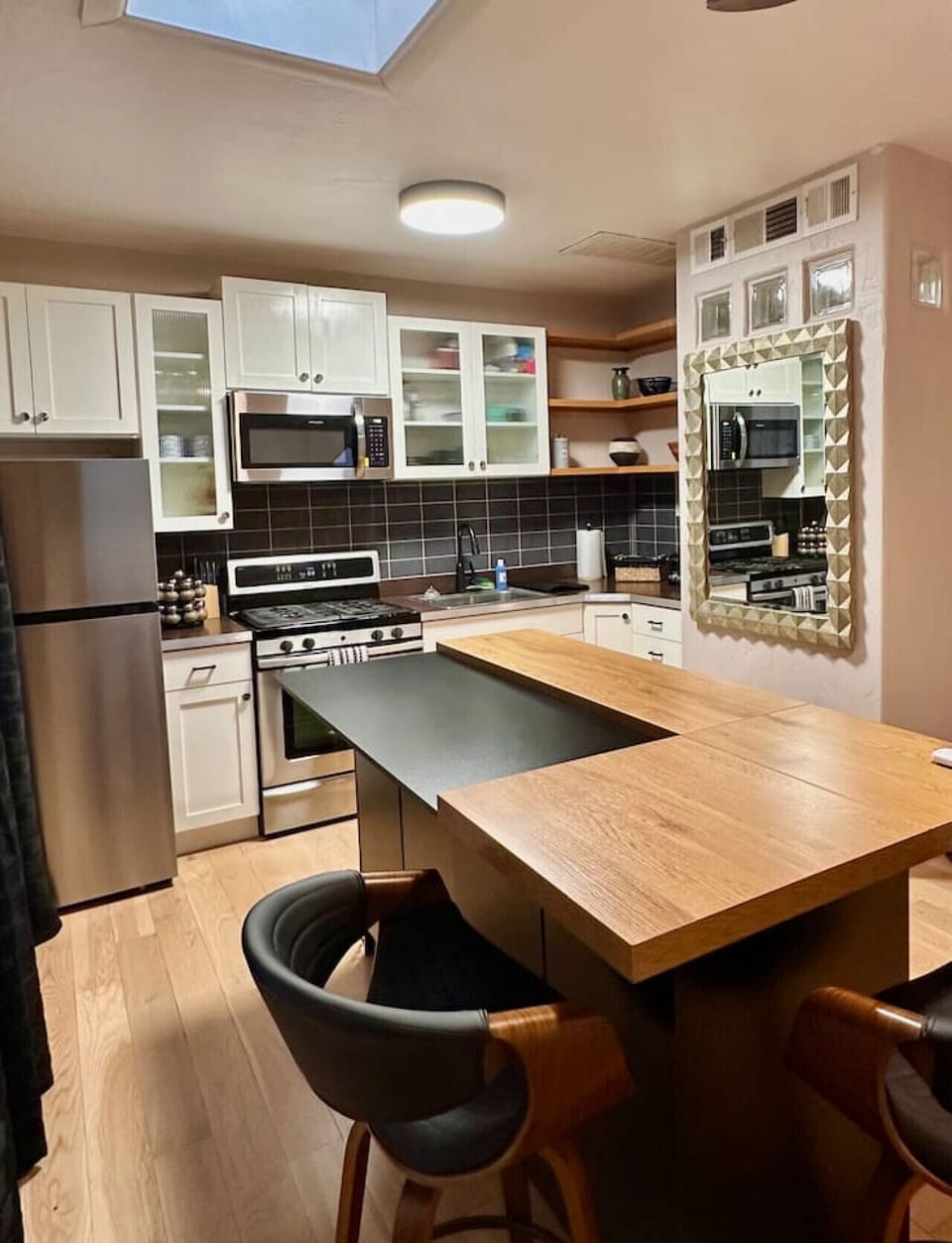 Kitchen - Modern Appliances, Island and Seating, and Cabinet Space