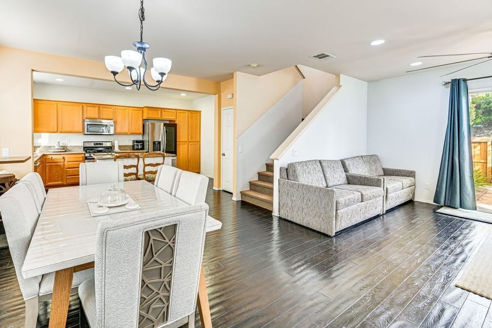 Dining room, living room, and kitchen area.